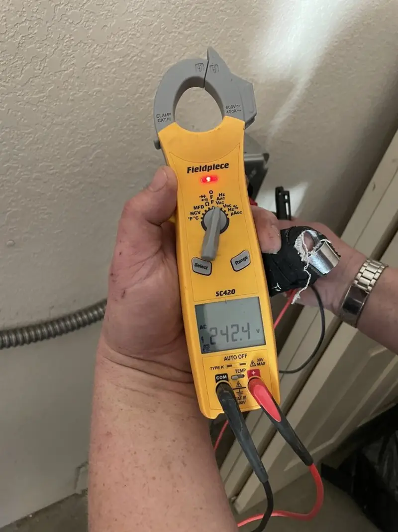 Voltage testing with clamp meter during Outlet Installation in Severna Park